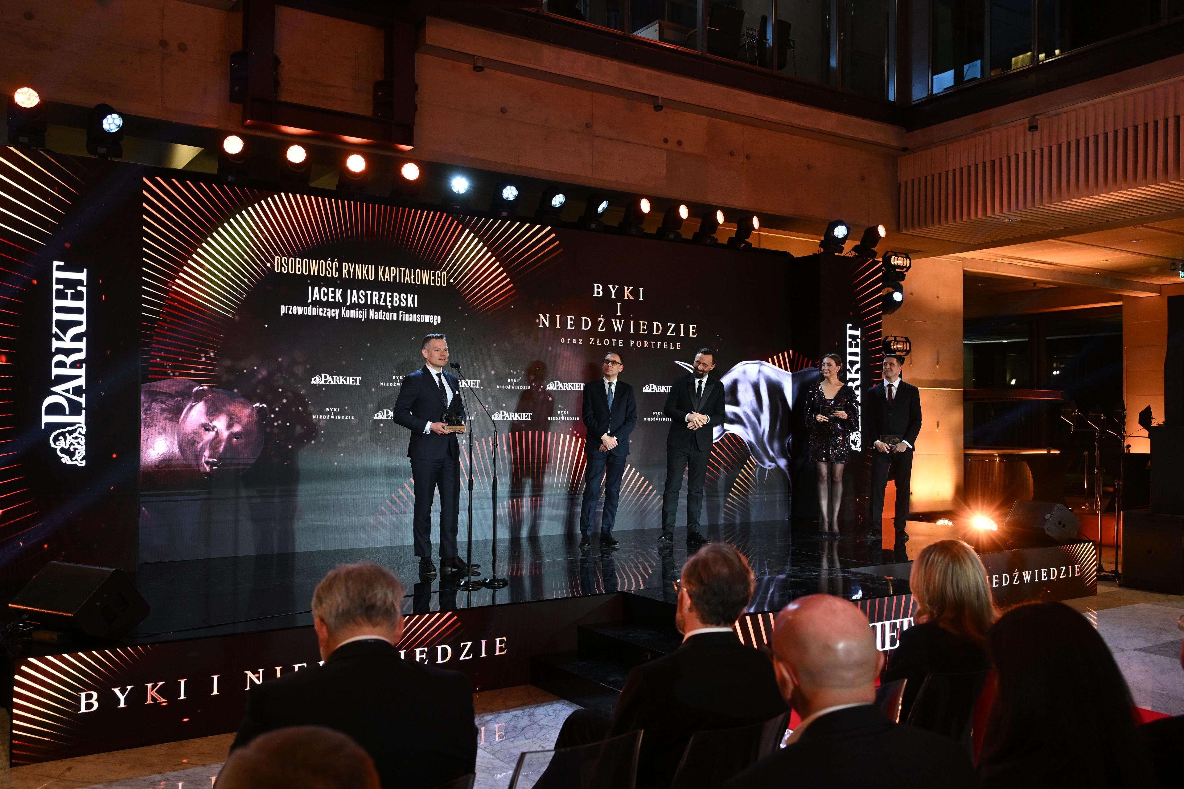Jacek Jastrzębski with an award on stage