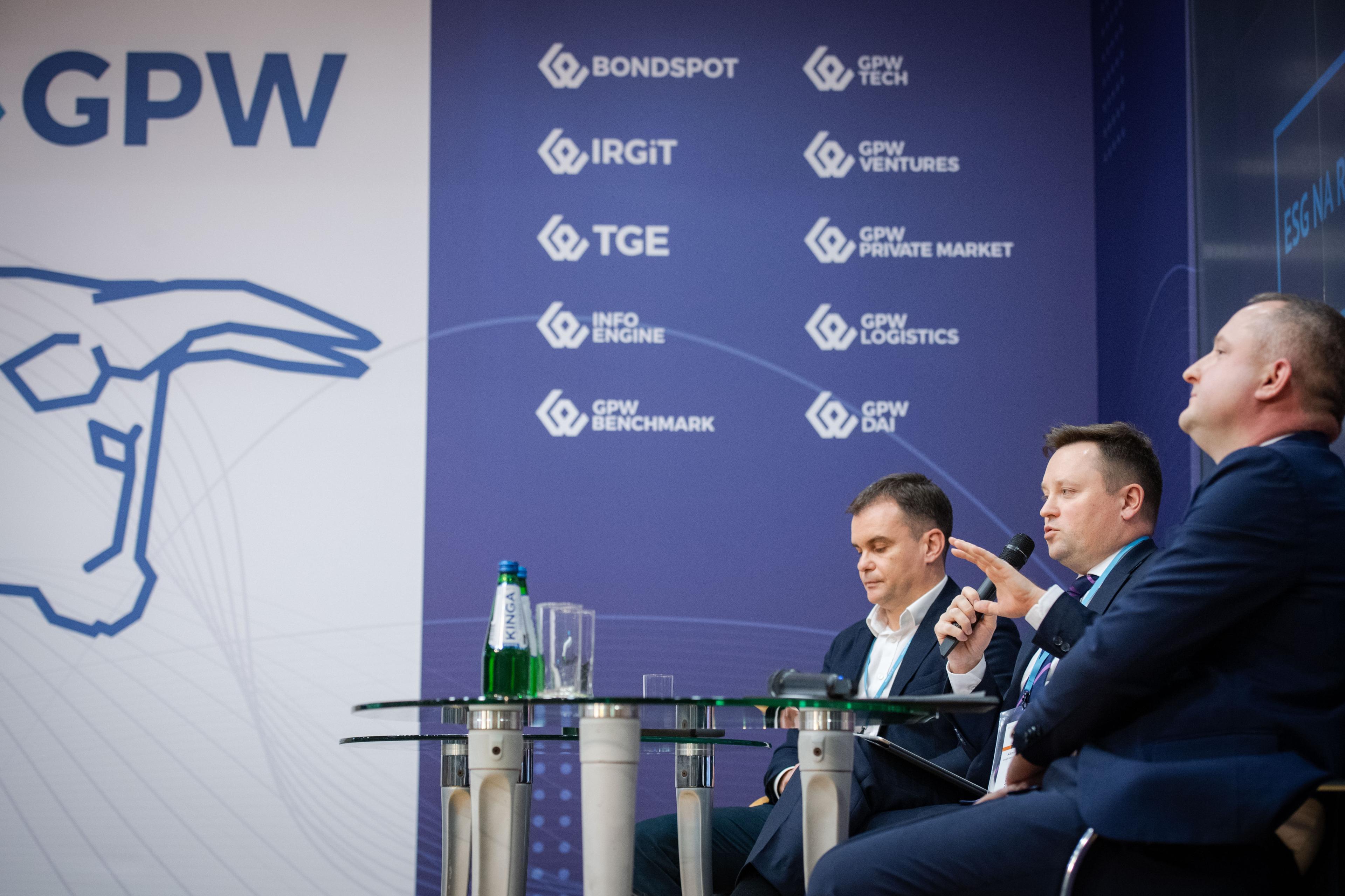 Kamil Liberadzki speaks to microphone on stage